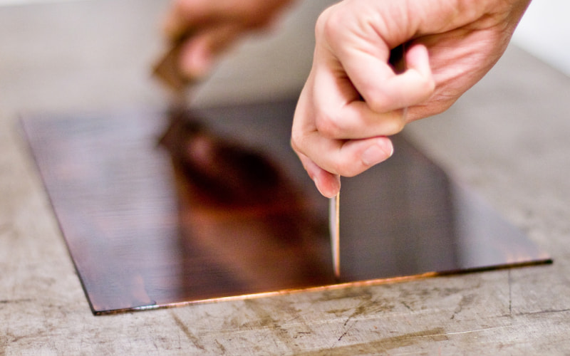 Sheet of metal being prepped for acid etching