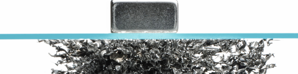 Magnet holding up metal materials