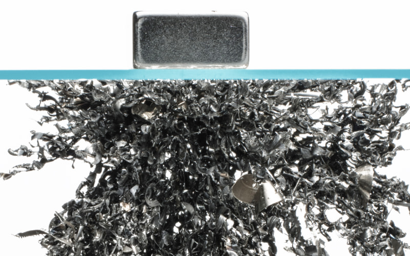 Magnet holding up metal materials