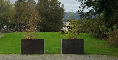 Two weathered steel planters